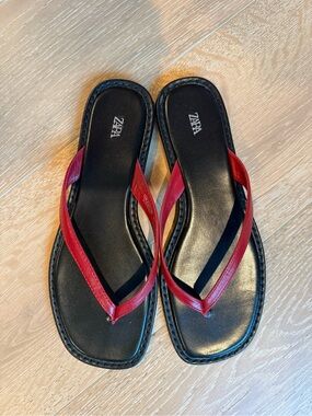 Like new red and black leather flip flops